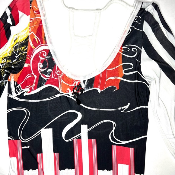 Save the Queen Ladies top. Medium Elbow length sleeves. Metal medallion accent. - Picture 2 of 13